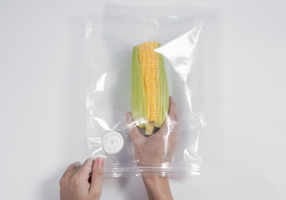 Put the corn into a vacuum bag